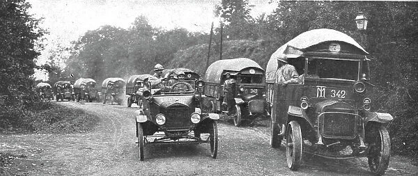 Au Volant; convoi d'autos-camions menes par des conducteurs indo-chinois, sous... 1918. Creator: Unknown