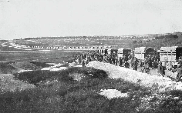 Au Volant; Sur une route strategique, a proximite de la ligne de feu: releve de troupes par...1918 Creator: Unknown