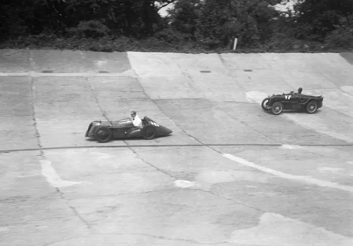 Framed Print : Austin 747 cc with sreamlined racing body leading an MG C type on the Members Banking at Brooklands Framed Print : Austin 747 cc with sreamlined racing body leading an MG C type on the Members Banking at Brooklands