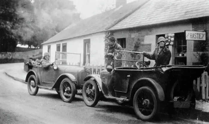Framed Print : Two Austin Sevens parked outside a small tea shop, c1925 Framed Print : Two Austin Sevens parked outside a small tea shop, c1925