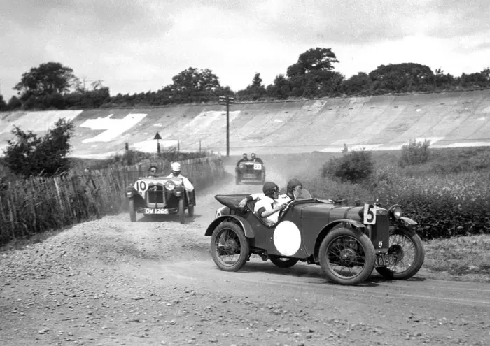 Framed Print : Two Austin Ulsters leading an MG, JCC Members Day, Brooklands, 4 July 1931. Artist: Bill Brunell Framed Print : Two Austin Ulsters leading an MG, JCC Members Day, Brooklands, 4 July 1931. Artist: Bill Brunell