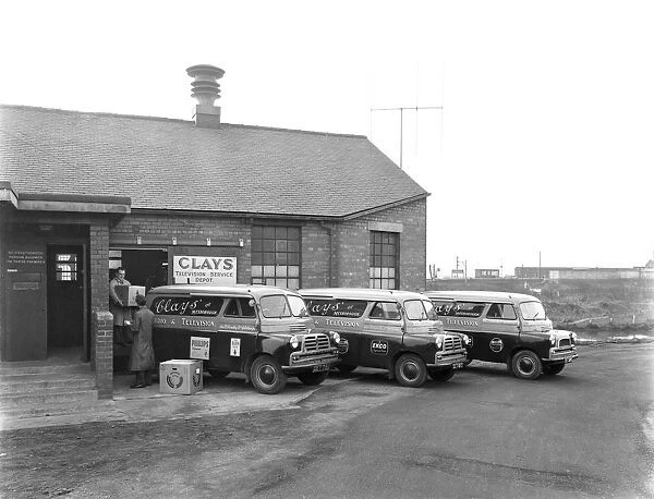 Austin vans being loaded outside Clays TV repair depot, Mexborough, South Yorkshire, 1959
