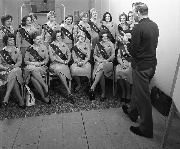 Australian sales girls with SPL sashes listen to a sales talk, Selby, North Yorkshire, 1965