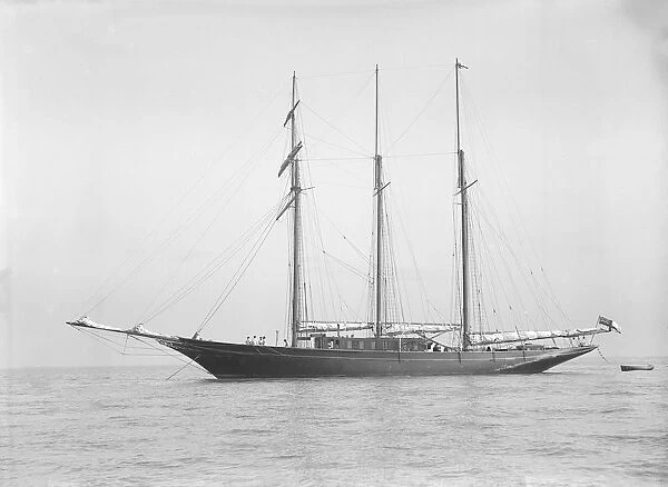 The auxiliary schooner La Cigale at anchor, 1913. Creator: Kirk & Sons of Cowes