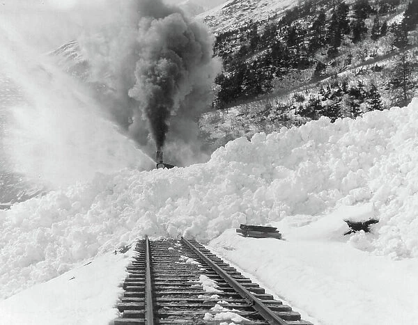 Avalanche of snow across railroad tracks, between 1890 and 1930. Creator: Frank G. Carpenter