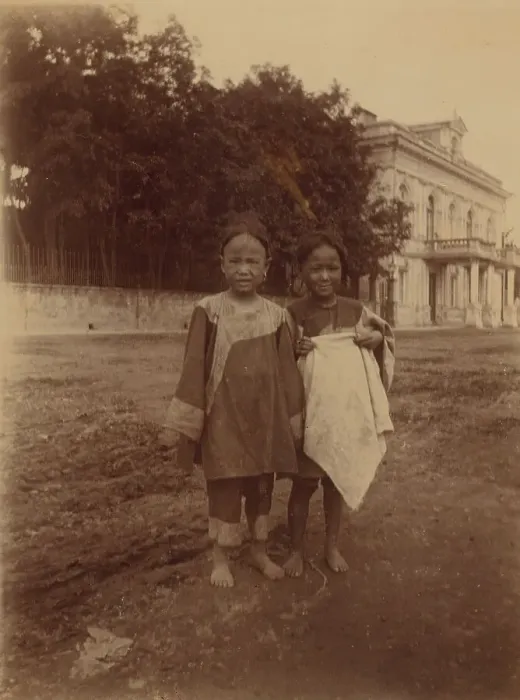 Framed Print : Two barefoot children standing in muddy street in front of the Lindholm's large... (1899?). Creator: Eleanor Lord Pray Framed Print : Two barefoot children standing in muddy street in front of the Lindholm's large... (1899?). Creator: Eleanor Lord Pray