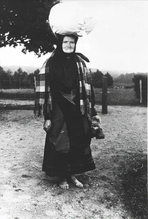 Framed Print : Barefoot woman carrying a sack on her head, walking to sell tissues, Mark's district... 1900-1910. Creator: Unknown Framed Print : Barefoot woman carrying a sack on her head, walking to sell tissues, Mark's district... 1900-1910. Creator: Unknown