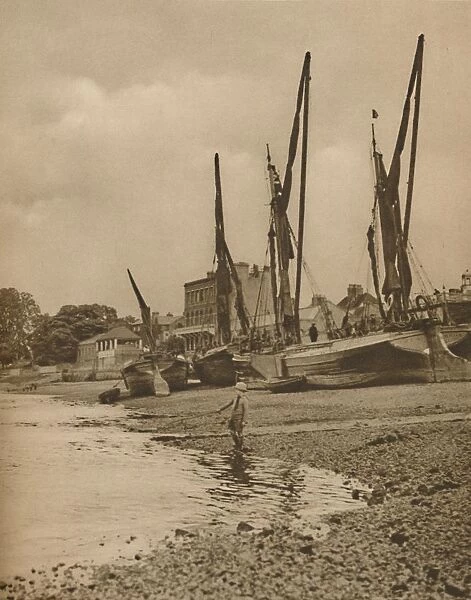 Barges Aground At Mortlake With The Tide at Full Ebb, c1935. Creator: Donald McLeish