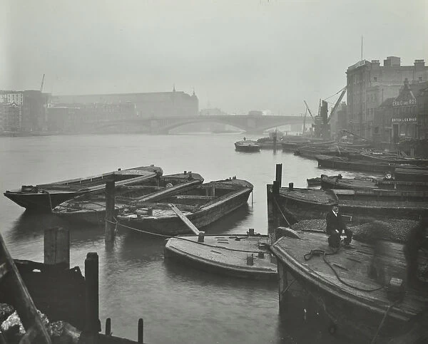 Barges moored at Bankside wharves looking downstream, London, 1913