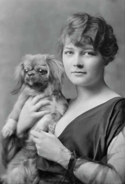 Barry, Constance, Miss, with dog, portrait photograph, 1914 Dec. 17. Creator: Arnold Genthe