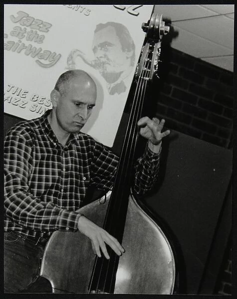 Bassist Simon Woolf playing at The Fairway, Welwyn Garden City, Hertfordshire, 2002