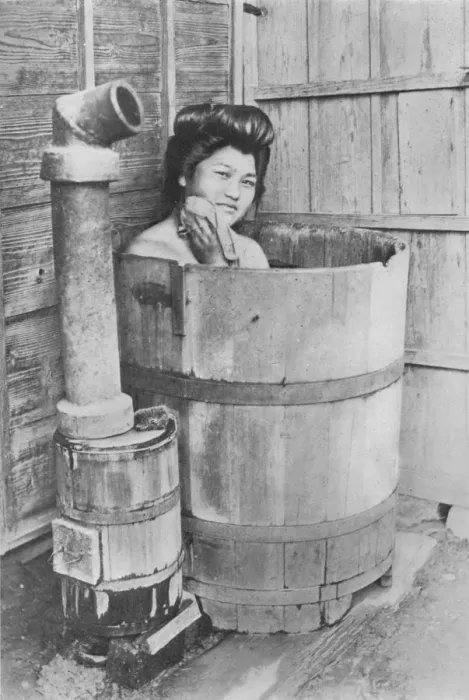 Framed Print : The bath is a large barrel with charcoal stove. Frequently out of doors, c1900, (1921). Artist: Julian Leonard Street Framed Print : The bath is a large barrel with charcoal stove. Frequently out of doors, c1900, (1921). Artist: Julian Leonard Street
