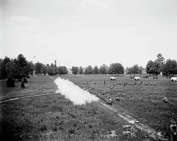 Battalion firing, kneeling, M[ichigan] M[ilitary] A[cademy], Orchard Lake, Michigan, c1900. Creator: Unknown