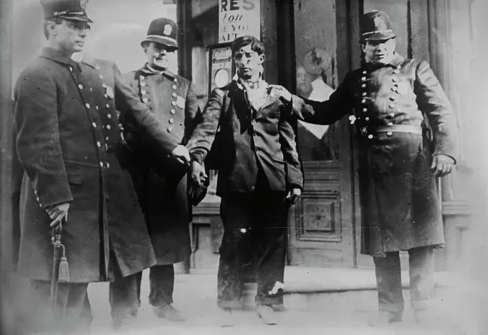 Framed Print : Battered striker with policemen, Philadelphia, 1910. Creator: Bain News Service Framed Print : Battered striker with policemen, Philadelphia, 1910. Creator: Bain News Service