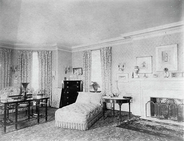 Bedroom with fireplace, and padded chaise longue, in home of...Greenwich, Connecticut, 1908. Creator: Frances Benjamin Johnston