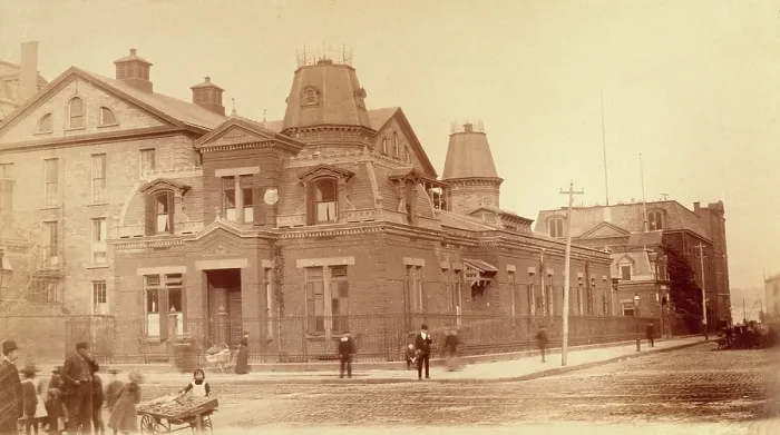 Framed Print : Bellevue Hospital, New York City: a street corner with hospital buildings and people, 1885-1898. Creator: Unknown Framed Print : Bellevue Hospital, New York City: a street corner with hospital buildings and people, 1885-1898. Creator: Unknown