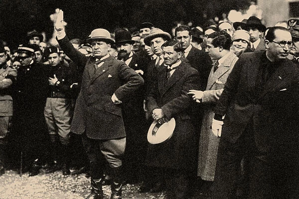 Benito Mussolini, between the members of the Fascist Party