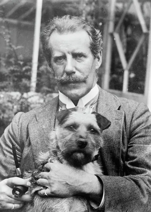 Framed Print : Bernard M. Partridge holding dog, 1910. Creator: Bain News Service Framed Print : Bernard M. Partridge holding dog, 1910. Creator: Bain News Service