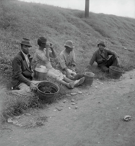 Berry pickers at 5 am, waiting for the truck to haul them to work, Memphis, Tennessee, 1938. Creator: Dorothea Lange