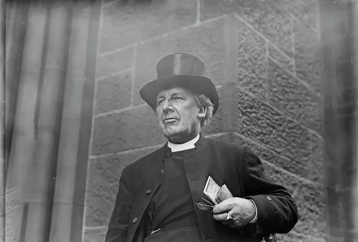 Framed Print : Bishop of Salisbury holding glasses and train schedule, 1910. Creator: Bain News Service