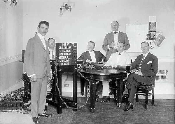 Bobroff Voting Machine - Being Considered For Use In House, Standing Right To Left: Reps... 1917. Creator: Harris & Ewing. Bobroff Voting Machine - Being Considered For Use In House, Standing Right To Left: Reps... 1917