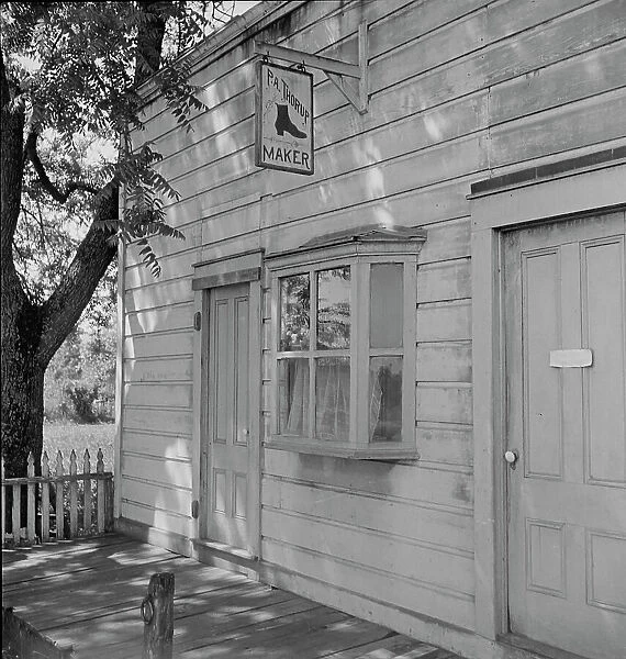 Boot and shoemaker shop in small California town, 1938. Creator: Dorothea Lange