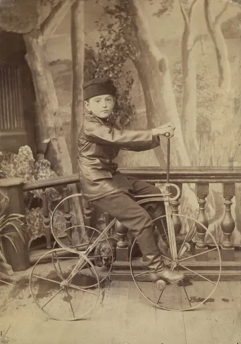Framed Print : A boy on a bicycle in a photo studio, 1880. Creator: Unknown Framed Print : A boy on a bicycle in a photo studio, 1880. Creator: Unknown