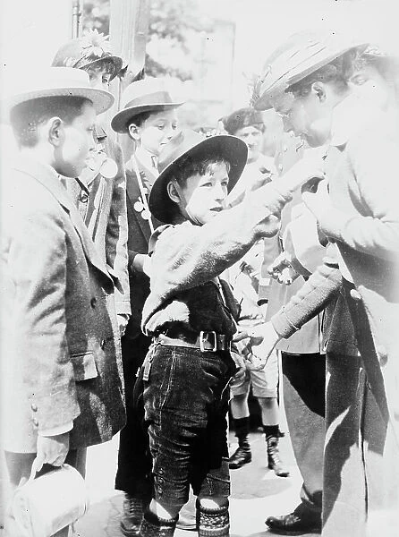 Boy Scout, Paris, Selling 'Journee Francaise' Medals, between 1914 and c1915. Creator: Bain News Service. Boy Scout, Paris, Selling 'Journee Francaise' Medals, between 1914 and c1915. Creator: Bain News Service