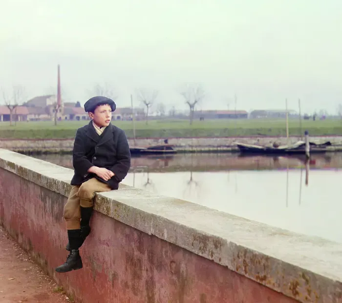 Framed Print : Boy sitting on sea wall, between 1905 and 1915. Creator: Sergey Mikhaylovich Prokudin-Gorsky Framed Print : Boy sitting on sea wall, between 1905 and 1915. Creator: Sergey Mikhaylovich Prokudin-Gorsky