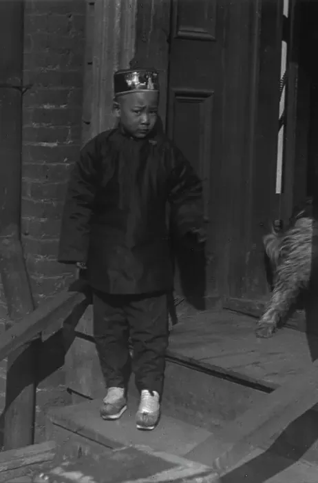Framed Print : Boy standing on steps in front of a doorway, Chinatown, San Francisco, between 1896 and 1906. Creator: Arnold Genthe Framed Print : Boy standing on steps in front of a doorway, Chinatown, San Francisco, between 1896 and 1906. Creator: Arnold Genthe