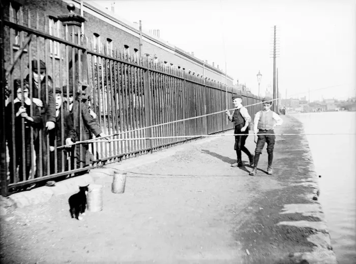 Framed Print : Boys fishing across a canal towpath, London, c1905 Framed Print : Boys fishing across a canal towpath, London, c1905
