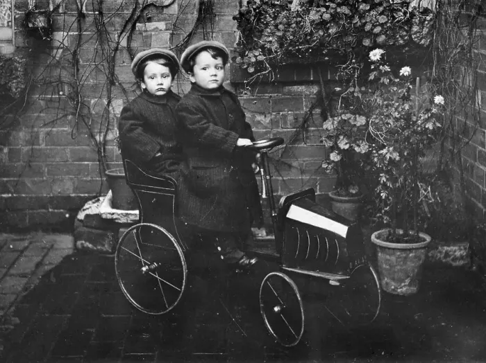 Framed Print : Two boys in a pedal car, (early 20th century?) Framed Print : Two boys in a pedal car, (early 20th century?)