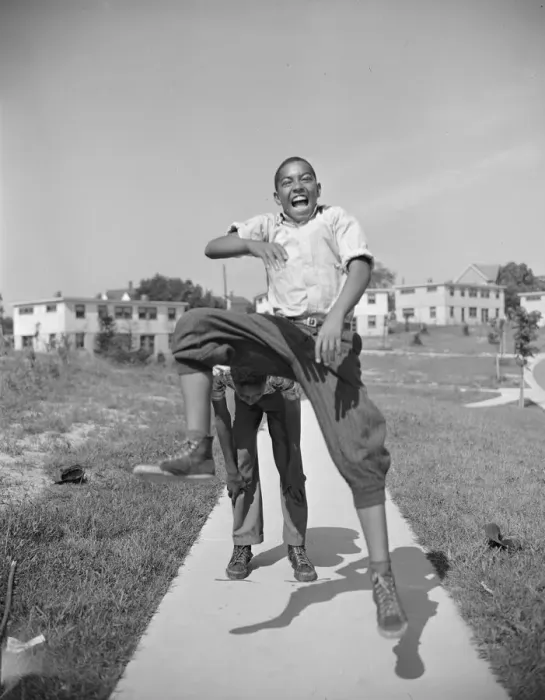 Framed Print : Boys playing leap frog near the project, Frederick Douglass housing project, Anacostia, D. C. 1942. Creator: Gordon Parks Framed Print : Boys playing leap frog near the project, Frederick Douglass housing project, Anacostia, D. C. 1942. Creator: Gordon Parks
