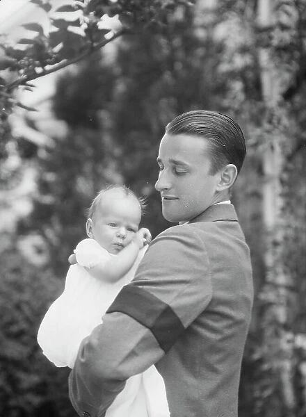 Brady, James Cox, Jr. Mr. and child, outdoors, 1930 May 24. Creator: Arnold Genthe