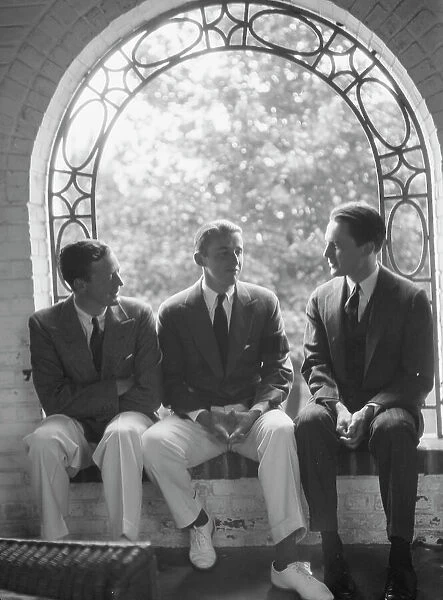Brady, Mosely, and Scott group, seated in a window, 1930 May 24. Creator: Arnold Genthe