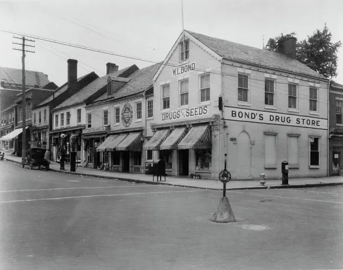 Framed Print : Brick Row, Commerce and Main Streets, located in the vicinity of Fredericksburg...Virginia, c1925. Creator: Frances Benjamin Johnston Framed Print : Brick Row, Commerce and Main Streets, located in the vicinity of Fredericksburg...Virginia, c1925. Creator: Frances Benjamin Johnston