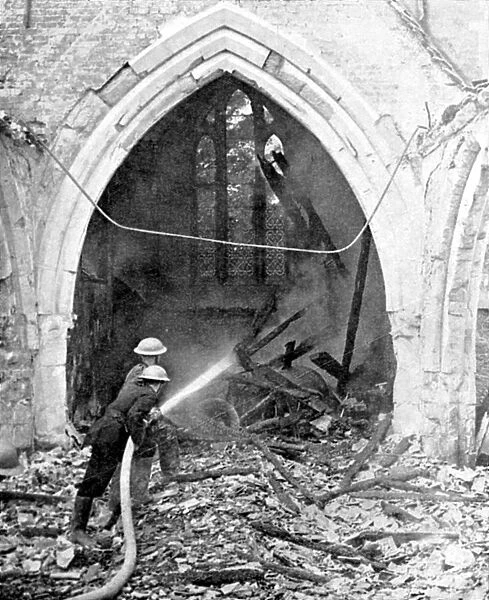 British firefighters damping down a bombed church, World War II, June 1940