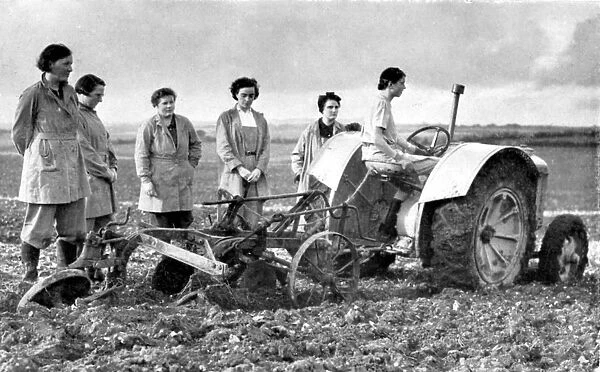 British girls of the Womens Land Army learning to plough with a tractor, World War II, 1939-1945