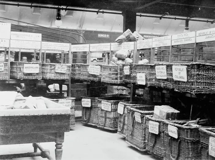 Framed Print : British Parcels Post-sorting parcels for foreign mail, between c1910 and c1915. Creator: Bain News Service Framed Print : British Parcels Post-sorting parcels for foreign mail, between c1910 and c1915. Creator: Bain News Service