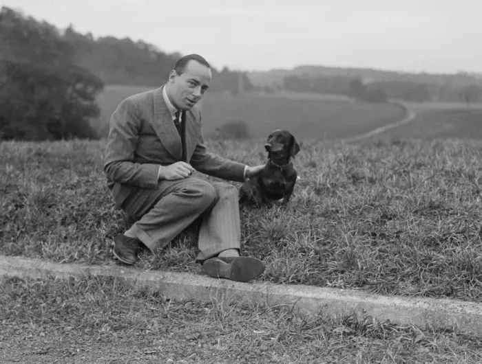 Framed Print : British racing driver Charles Mortimer and his pet dachshund, c1930s Artist: Bill Brunell Framed Print : British racing driver Charles Mortimer and his pet dachshund, c1930s Artist: Bill Brunell
