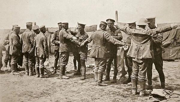 British soldiers searching captured German prisoners, Somme campaign, France, World War I, 1916