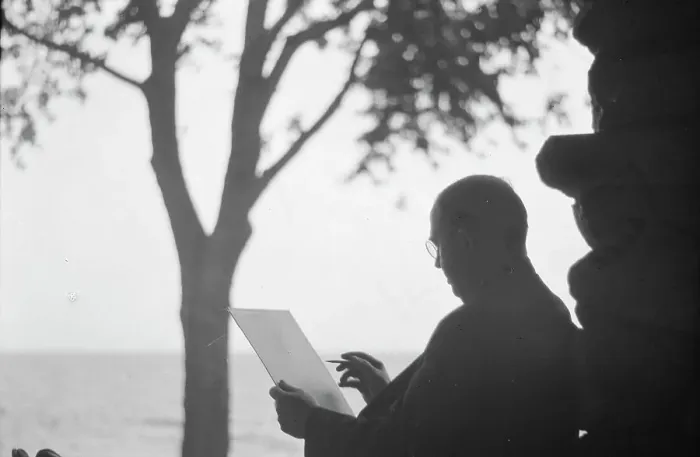 Framed Print : Bruce, Ned, Mr. reading and writing outdoors, 1915? Creator: Arnold Genthe Framed Print : Bruce, Ned, Mr. reading and writing outdoors, 1915? Creator: Arnold Genthe