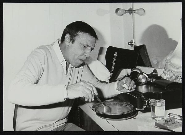 Buddy Rich eating backstage at Ronnie Scotts Jazz Club, London, 1979