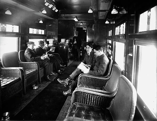 Buffet library car on a deluxe overland limited train, between 1910 and 1920. Creator: Unknown