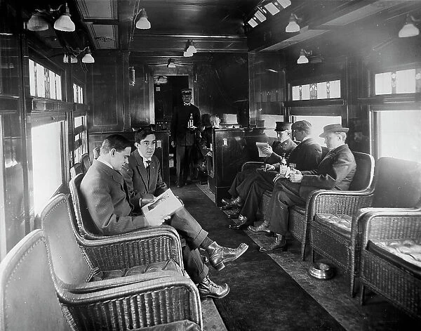 Buffet library car on a deluxe overland limited train, between 1910 and 1920. Creator: William H. Jackson
