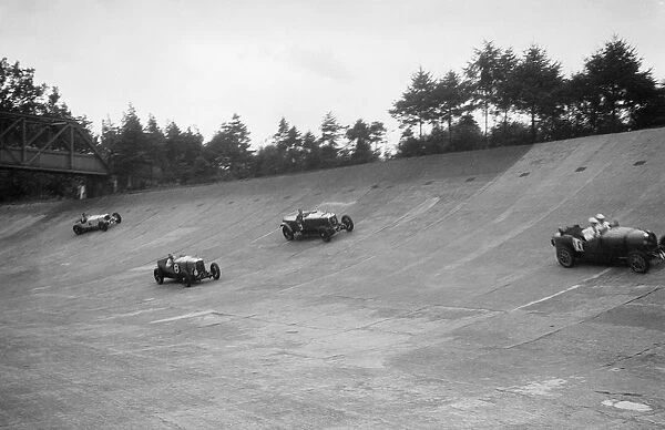 Bugatti Type 43, Sunbeam and Invicta racing on the Members Banking at Brooklands