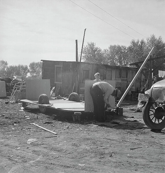 Building an auto trailer in a squatter camp, Outskirts of Bakersfield, California, 1936. Creator: Dorothea Lange