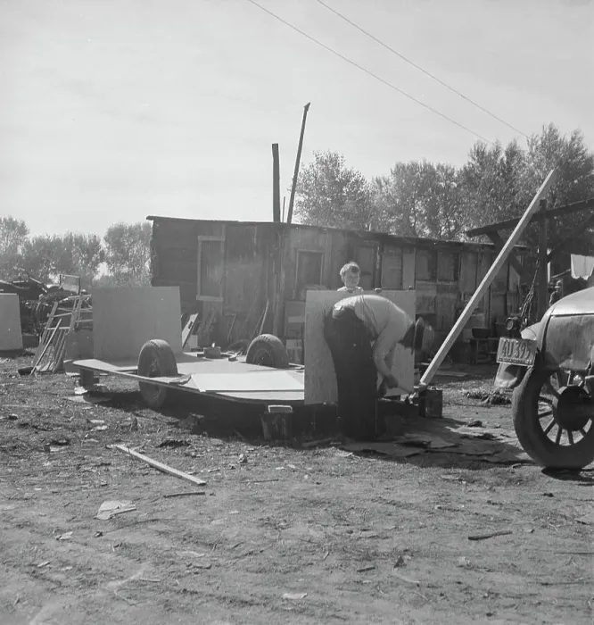 Framed Print : Building an auto trailer in a squatter camp, Outskirts of Bakersfield, California, 1936. Creator: Dorothea Lange Framed Print : Building an auto trailer in a squatter camp, Outskirts of Bakersfield, California, 1936. Creator: Dorothea Lange
