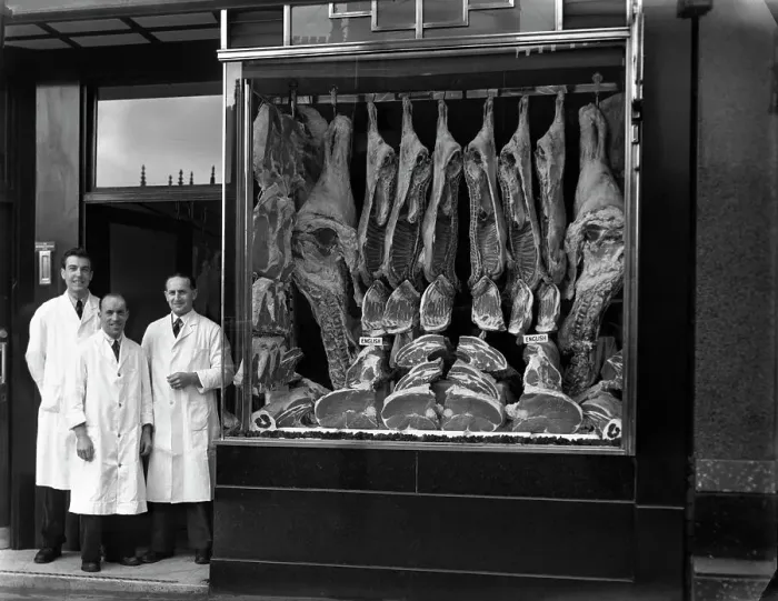 Framed Print : Butchers standing next to their shop window display, South Yorkshire, 1955. Artist Framed Print : Butchers standing next to their shop window display, South Yorkshire, 1955. Artist
