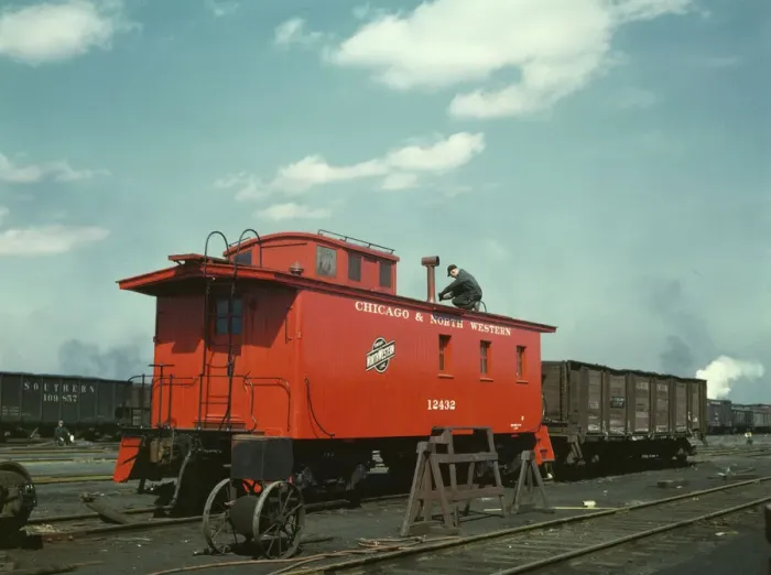 Framed Print : C & NW RR putting the finishing touches on a rebuilt caboose... Proviso yard, Chicago, Ill. 1943. Creator: Jack Delano Framed Print : C & NW RR putting the finishing touches on a rebuilt caboose... Proviso yard, Chicago, Ill. 1943. Creator: Jack Delano